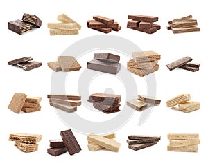 Set of different delicious crispy wafers on white photo