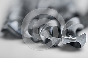 Set of different drill bits on white background