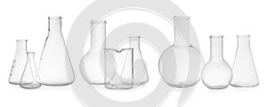 Set of different empty laboratory glassware on white background, banner design