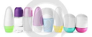 Set of different female roll-on deodorants on white