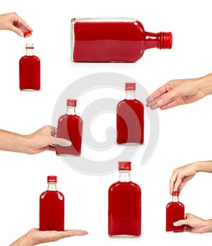 set of different Glass bottle with red tincture with hand. isolated on white background. Alcohol problem