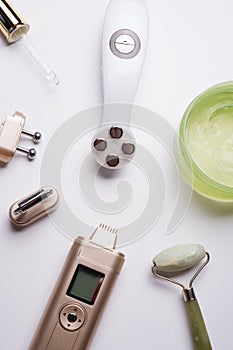 Set of different hardware equipment with vacuum jars, nephrite roll and massage brush. anti-age and anti-cellulite set for home