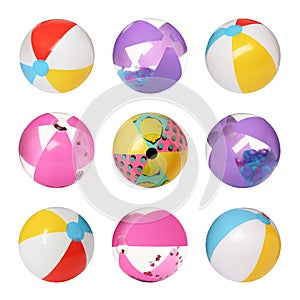 Set with different inflatable beach balls on white