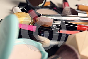 Set of different makeup products and tools as background