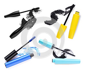 Set with different mascaras and strokes on white background, top view