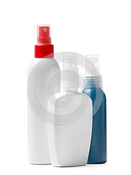 A set of plastic bottles with a sprayer and a pump dispenser for cosmetics, isolated on a white background