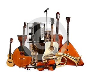 Set of different musical instruments and microphone on white background