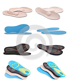 Set with different orthopedic insoles on background