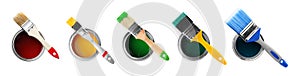 Set of different paint brushes and cans on white background