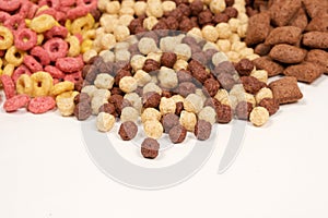 A set of different quick breakfast cereals - rings, balls and pads.