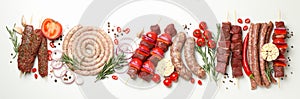 Set of different raw barbecue meat on white background, top view
