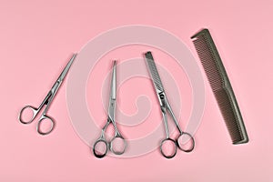 Set of different scissors for barber. Hairdressing tools, comb and different scissors