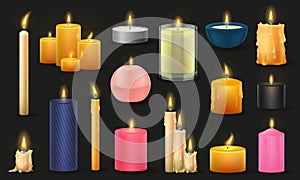 Set of different sized candles isolated on a black background. A many types of colorful wax candles.