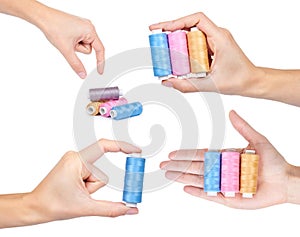 set of different spool of thread with hand, isolated on white background