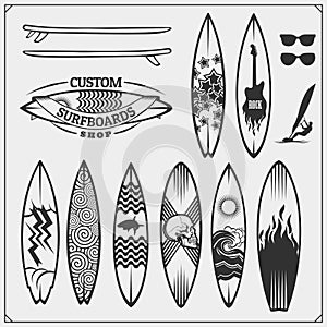 Set of different surfboards. Vector illustration. Surfing emblems, icons and labels.