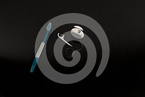 Set of different tools for dental care on black background