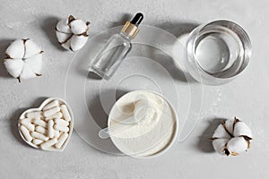 Set of different types of collagen. Collagen powder, tablets and liquid collagen on a gray background. Fish or plant based. photo