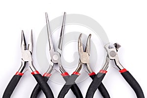 Set of different types of pliers and side cutters isolated on white background. Hand tools for repair