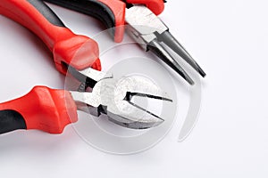 Set of different types of pliers and side cutters isolated on white background. Hand tools for repair