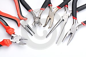Set of different types of pliers and side cutters isolated on white background. Hand tools for repair