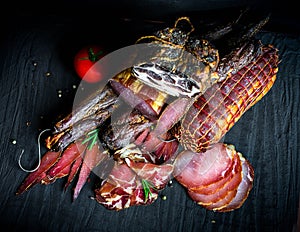 A set of different types of raw smoked meat.