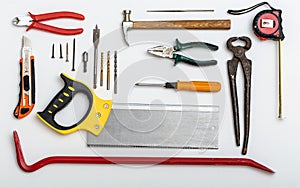 Set of different used tools on white plate