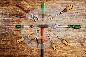 Set of different working tools on wooden background. Top view. Hand tool. Tools male workplace background texture dark wood. Copy