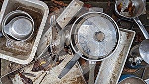 A set of dirty kitchenalia in an outdoor mud kitchen