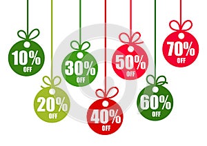 Set of discount tags 10,20,30,40,50,60,70 percent off in the shape of Christmas balls in traditional colors. Winter holiday