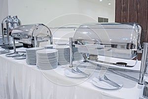 Set of dishes for dinner party at the banquet table