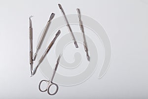 Set of disinfected manicure or pedicure tools. Cuticle pushers and scissors for safe hygiene, beauty and nails care. Top view.