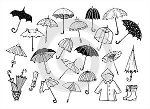 Set of doodle sketch umbrellas on white background photo