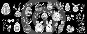 set of doodled hand-drawn Easter eggs and bunnies