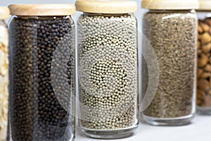 Set of dried spices and herbs in glass bottles , Variety of spices
