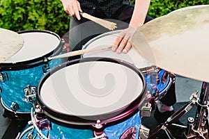 Set of drums being played by drummer