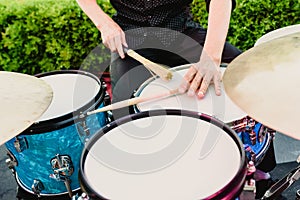 Set of drums being played by drummer