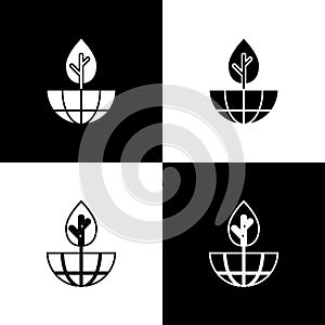 Set Earth globe and plant icon isolated on black and white background. World or Earth sign. Geometric shapes