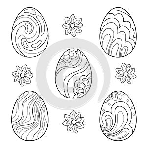 Set of Easter eggs with floral doodle patterns and flowers on a white isolated background.