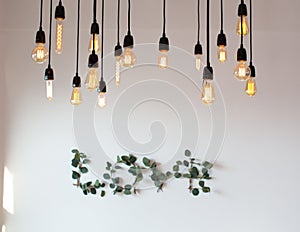 Set edison retro lamp on loft gray concrete background. Concept idea. Love. Warm.