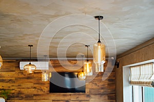 Set edison retro lamp on loft wooden wall background