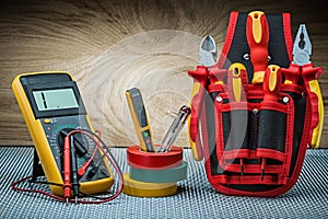 Set of electrical tools on wood background
