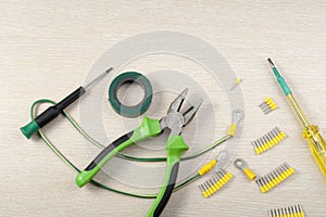 Set of electrical tools on wooden background. Energy concept.Copy space for text.