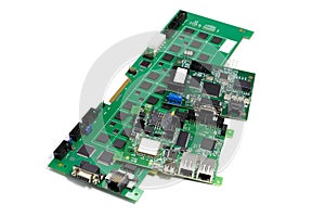 Set of electronic printed circuit boards with microchips and other components, angled view, isolated on white