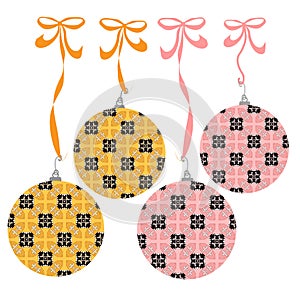 Set of elegant finely detailed ornate gold and pink Christmas ornaments hang from ribbons and bows.