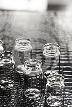 Set of Empty little bottles with black leather background