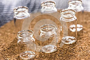 Set of Empty little bottles with cork background