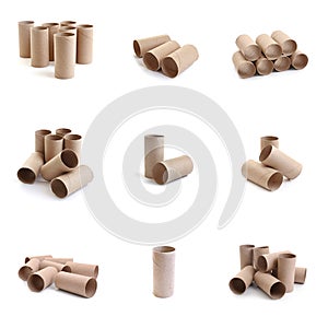 Set with empty paper toilet rolls on background