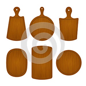Set of empty wooden cutting boards in different shapes isolated on white background. Vector illustration of kitchen object