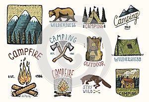 Set of engraved vintage, hand drawn, old, labels or badges for camping, hiking, hunting with mountains, campfire and