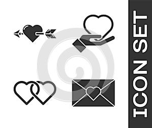 Set Envelope with Valentine heart, Amour with heart and arrow, Two Linked Hearts and Heart on hand icon. Vector